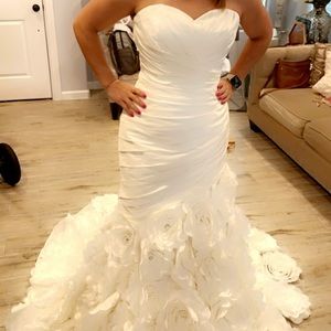 Wedding dress. Never worn. Brand new. Bridal size 12. Actual size fits a 6 or 8